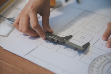 engineer people meeting working and pointing at a blueprint in office for discussing. Engineering tools and construction concept