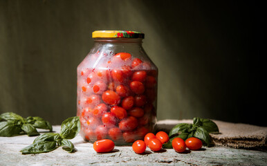 red and yellow cherry tomatoes in a jar for winter
