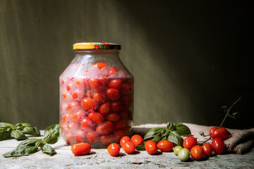 red and yellow cherry tomatoes in a jar for winter