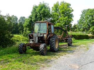 Hiking in the Argonne forest in France - View of a ruined tractor