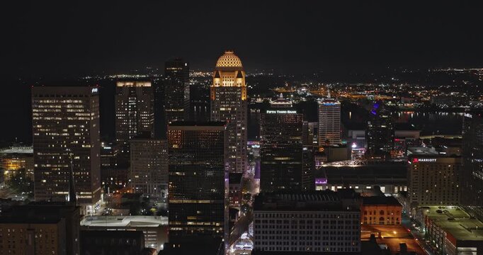 Louisville Kentucky Aerial v37 low drone flyover downtown area capturing illuminated cityscape, riverside freeway traffic, river crossing bridges at night - Shot with Inspire 3 8k - Sept 25th 2023