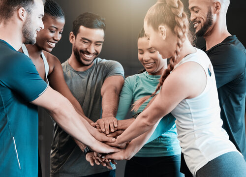 People, hands and stack at gym for fitness group, support and teamwork motivation for exercise. Friends, class and pile for workout collaboration at health club, solidarity and training community
