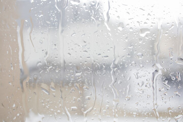 Rain drops on the window close up background