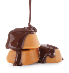Pouring delicious melted chocolate onto caramel candies isolated on white