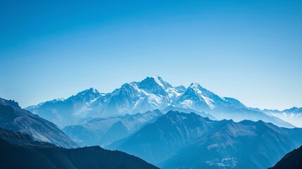 Fototapeta premium Mountains with snow-capped peaks and clear blue skies, a stunning natural landscape