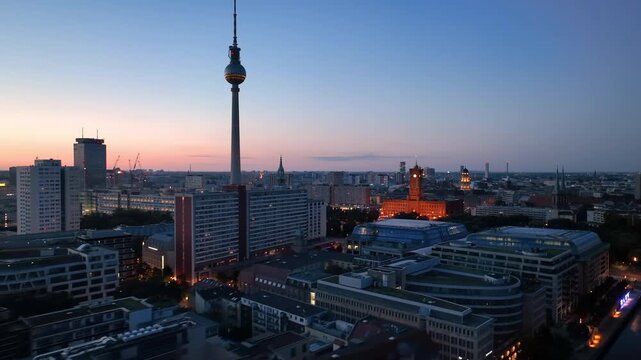 Aerial view of famous places architectural landmarks TV Tower and Berlin Cathedral, Alexanderplatz at night. Drone flight above City of Berlin, Germany