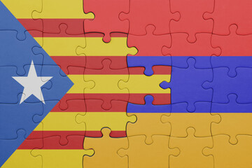 puzzle with the colourful national flag of armenia and flag of catalonia.