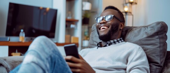 Obraz premium Businessman gives a video call to her client while using his mobile phone. Stock image.