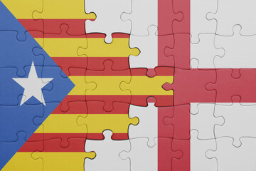 puzzle with the colourful national flag of england and flag of catalonia.