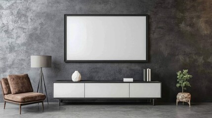 Modern living room interior with a white cabinet, armchair, lamp, and a blank framed canvas above it on a textured gray wall.
