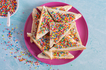 Slices of fairy bread on a plate. Fairy bread is a traditional Australian party food