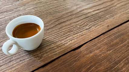 cup of coffee on wooden table