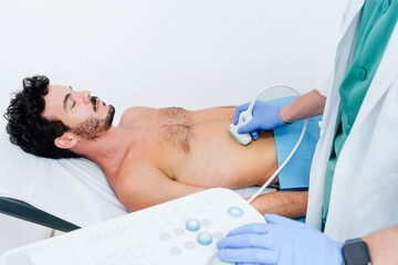 Doctor Using Ultrasound on Patient in Hospital