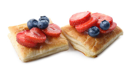 Tasty puff pastries with berries isolated on white