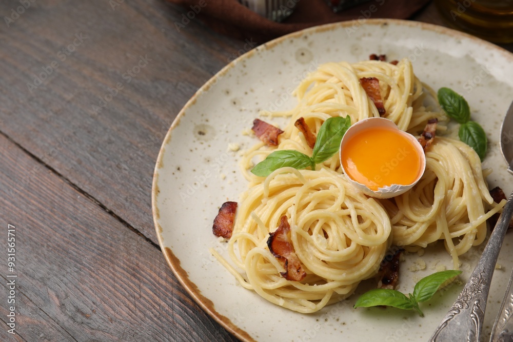 Canvas Prints Delicious pasta Carbonara served on wooden table, closeup