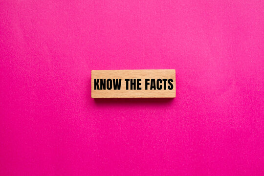 Know the facts message written on wooden block with pink background. Conceptual know the facts symbol. Copy space.