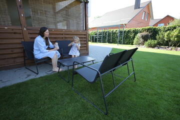 Mother and a child eating ice cream at home