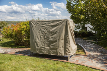 outdoor furniture in a rain cover