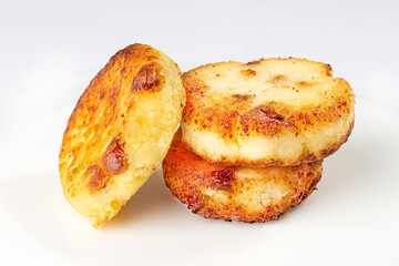 Cottage cheese pastries, syrniki on a white background