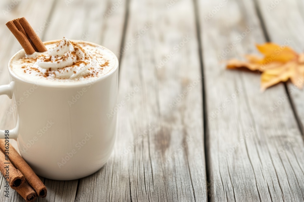 Sticker Pumpkin spice latte crowned with a cinnamon stick radiates comfort and warmth on a weathered wooden table embodying the tranquil charm of an Octobers autumn day 