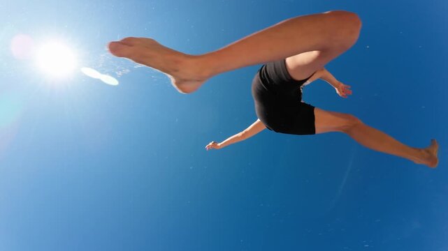 Girl jumping outdoors. Slow motion.