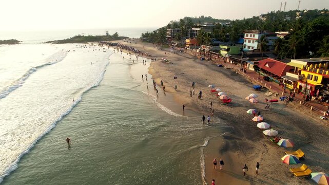 Exotic Tropical beach aerial view. Sea and sandy beach Aerial view ocean with waves. Kovalam beach, India, Kerala