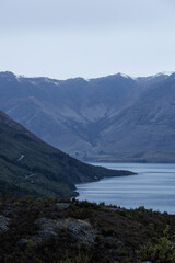 Lake coastline and mountain range at Queenstown, New Zealand.