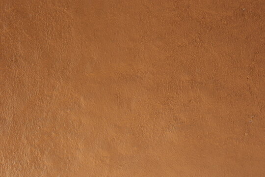 Soil wall texture of old clay house structure. Mud home. 