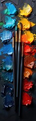 Brushes that are sitting on a paint palette