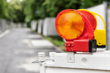 Warning Lights on Road Block Fence. No entry Sign on Green Nature Background.