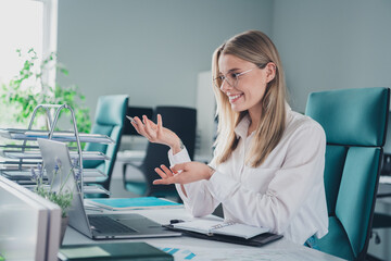 Photo of nice elegant young woman communicate video call laptop wear shirt modern office building...