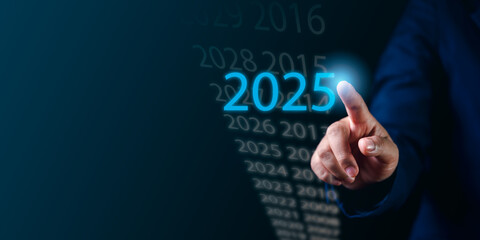 Businessman's Hand Displaying a Virtual Screen with 2025 Investment Analysis Exploring Future Market Trends, Financial Forecasts, and the Role of Technology in Strategic Planning