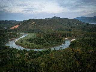 Naklejka premium Aerial view morning sunrise with fog river tropical rainforest mountain