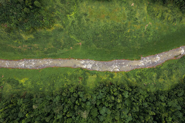 Beautiful aerial view green forest and river in the countryside of Nakhon Nayok Province, Thailand.