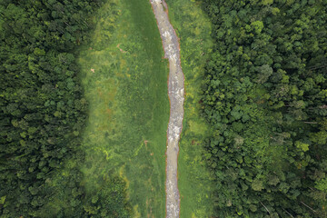 Beautiful aerial view green forest and river in the countryside of Nakhon Nayok Province, Thailand.