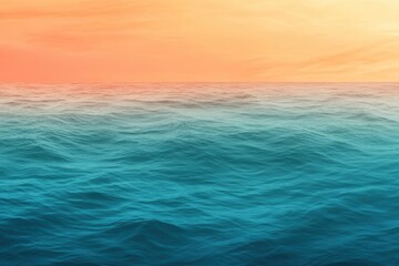 Fototapeta premium A gradient moving from a warm orange to a cool teal with a subtle grain effect, resembling a sunset over the ocean.