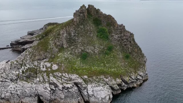 Thatcher Rock seen from clifftip footpath in Wellswood, Torquay, Devon, UK