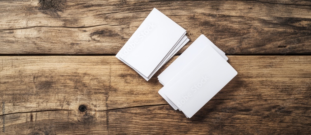 Aufkleber image of empty business cards on a wooden table background id template copyspace for text top view