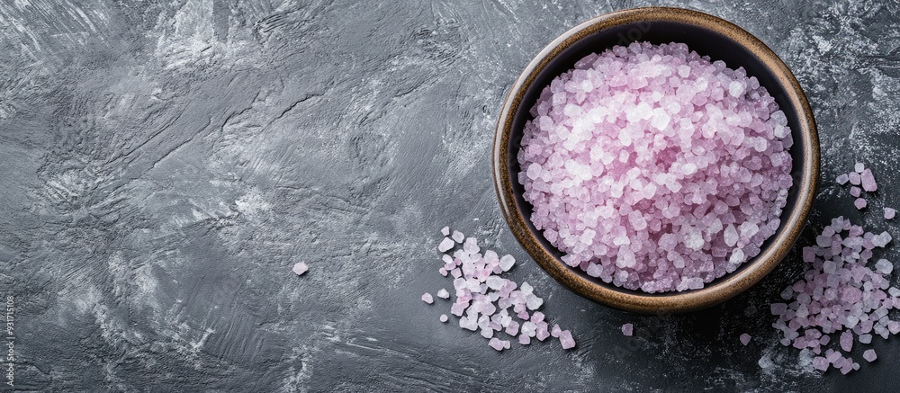 Poster mineral bath salt on a grey background top view frame with copy space