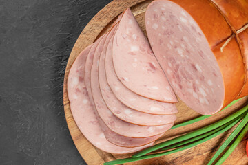 Tasty meat sausages. Turkey Boiled Ham on a wooden board, top view. copy space © Надія Коваль