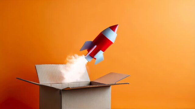 Toy rocket taking off from a cardboard box, startup and delivery concept.