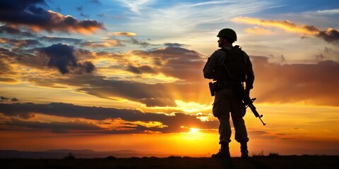 The silhouette of a soldier against the dawn horizon symbolizes the quiet strength and readiness as they face the challenges of a new day