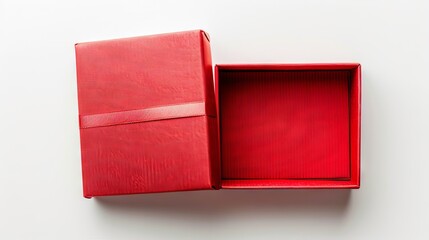 A beautifully wrapped red gift box, in open condition, rectangular in shape, on a white background, overhead shot 