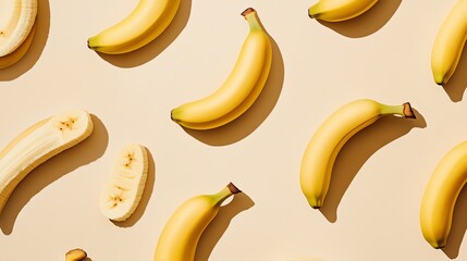 A pattern of bananas and banana slices on a beige background.