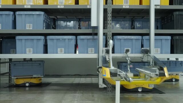 Demonstration of Automated Retail Warehouse AGV Robots Delivering distribution product stock on shelf in modern factory. Smart warehouse Logistics management system with warehouse robot. AI Technology