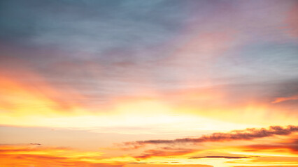 Fototapeta premium Beautiful , luxury soft gradient orange gold clouds and sunlight on the blue sky perfect for the background, take in everning,Twilight, Large size, high definition landscape photo