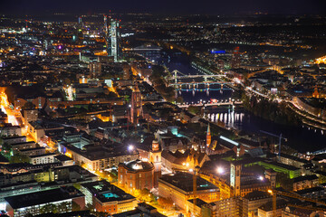 Fototapeta premium Frankfurt am Main, big skyline at night. Train station, railway, bank district.