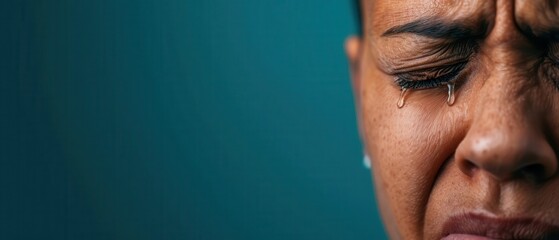 Closeup of a person s face showing deep emotional pain, tears blending with dark shadows, Pain, Emotional Agony