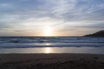 Stunning sunset over sea in Golden Bay Malta.