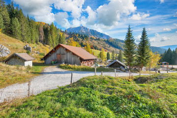 Gorgeous view of mountains and valleys with larch forest and wonderful sky are located in Filzmoos